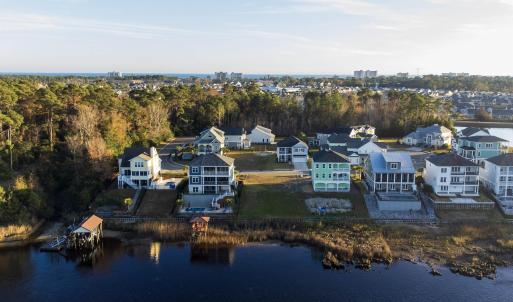 Aerial view of residential area with a large body