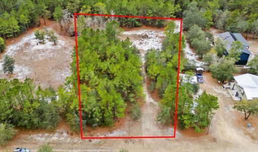 View of property location featuring a heavily wood