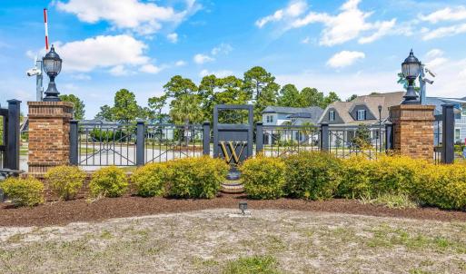 View of home's community featuring a gate