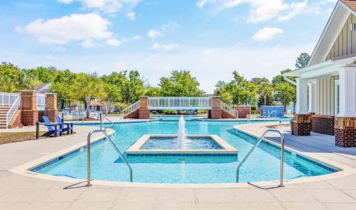 Community pool with a patio area and stairs