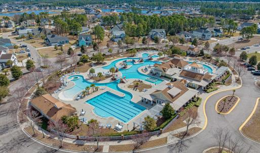 Aerial view of residential area featuring a pool a