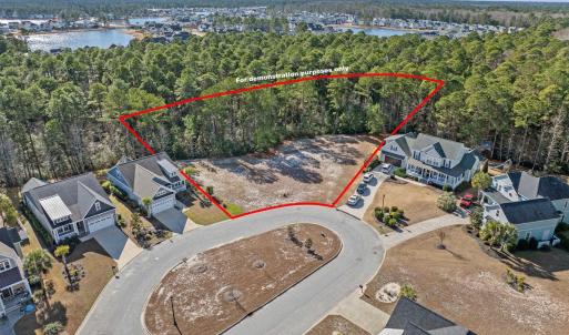 Aerial view of residential area with a nearby body