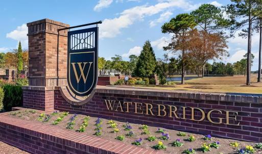 Community sign with a water view