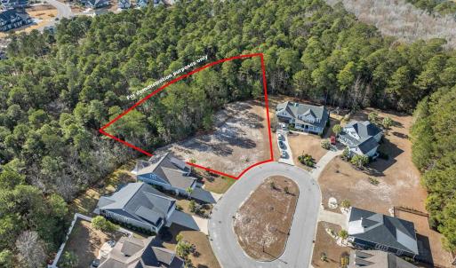 Aerial view of residential area with a forest. Bou