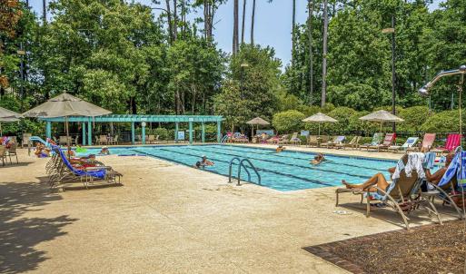 Community pool with a patio