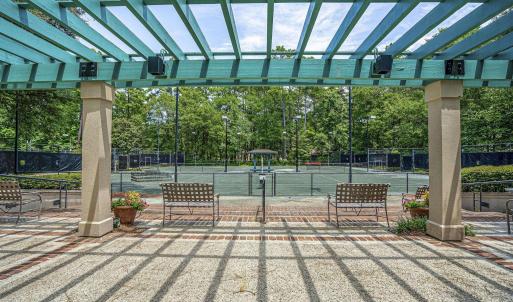 View of patio featuring a pergola and a tennis cou