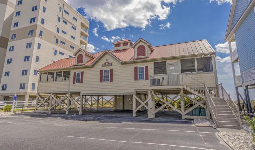 View of property with stairs