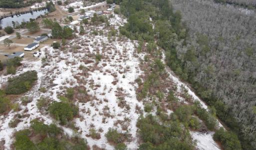 Aerial overview of property's location with a larg