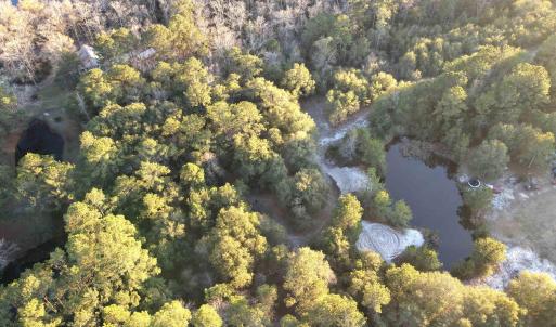 Aerial view of property and surrounding area with
