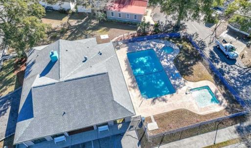 View of subject property featuring a pool area