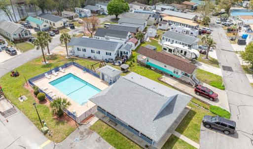 Aerial perspective of suburban area with a pool ar