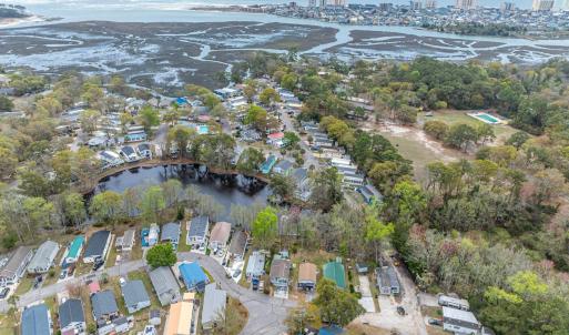 View of property location with a nearby body of wa