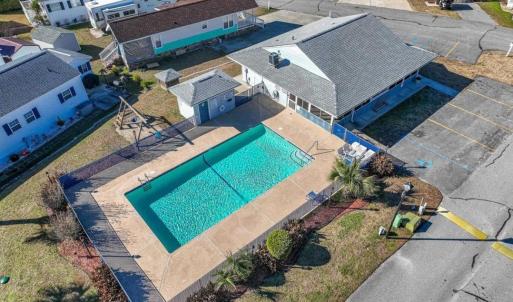 Aerial perspective of suburban area with a pool ar