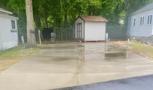 View of yard featuring a shed