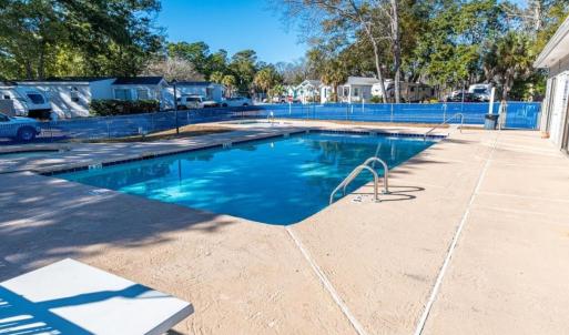 Community pool featuring a patio area and a reside