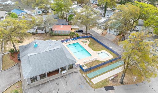 Aerial view of residential area featuring a pool