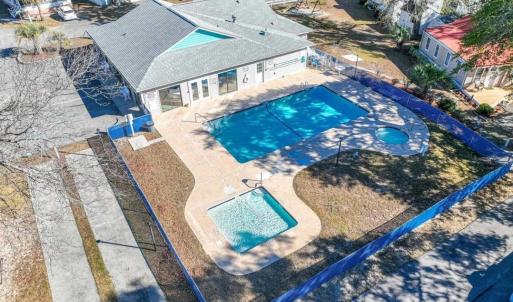 View of subject property featuring a pool area