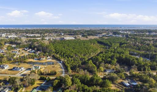 Aerial view of property and surrounding area featu