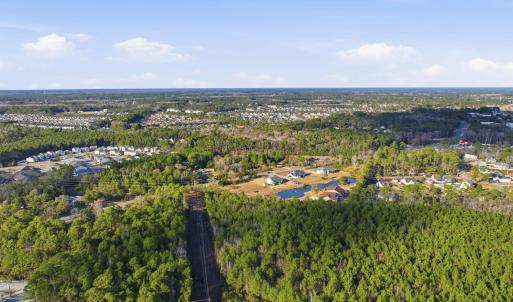 Aerial view of property and surrounding area with