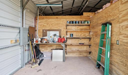 Garage with electric panel and metal wall