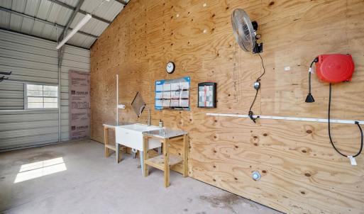 Misc room featuring concrete flooring, a garage, a