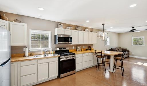 Kitchen featuring concrete floors, decorative ligh