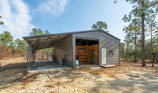 View of outbuilding with a carport