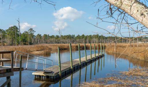 Dock area featuring a water view