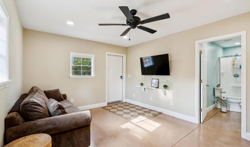 Living area featuring finished concrete floors, re
