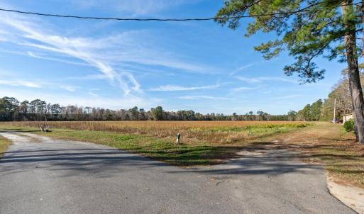 View of asphalt road with a view of rural / pastor
