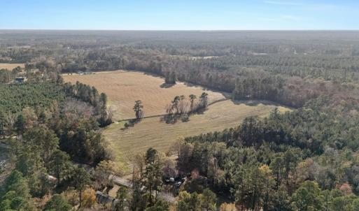 View of property location featuring a forest and r