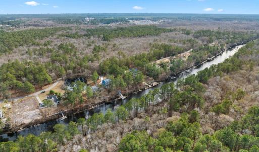 Aerial view of property and surrounding area with