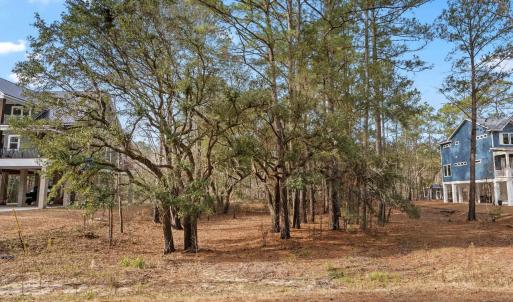 View of yard with covered porch and stairway