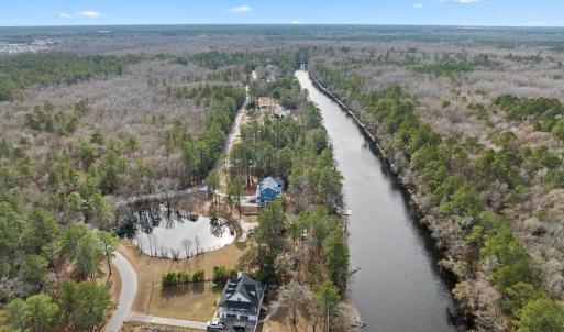 Aerial view of property and surrounding area with