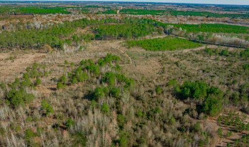 Aerial view of property and surrounding area with