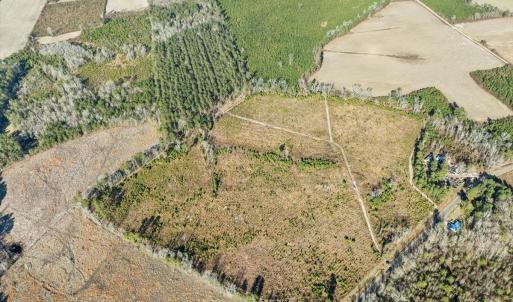 Aerial view of property's location with large plot