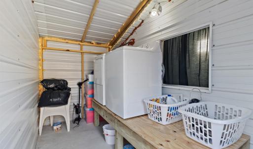 Wooden terrace featuring washer / dryer