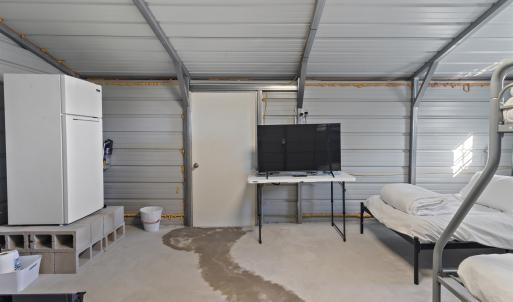 Garage featuring freestanding refrigerator and met