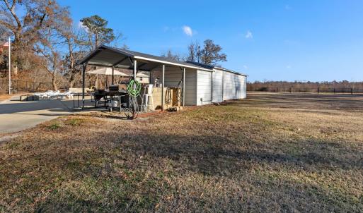View of the property featuring fencing, a gazebo a