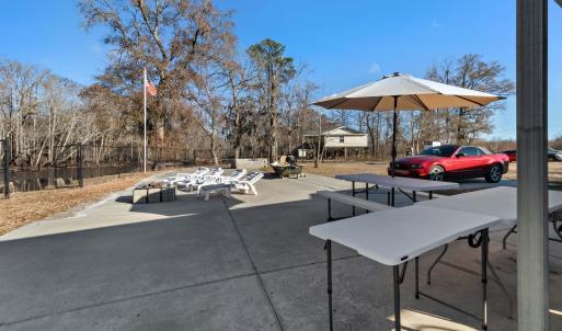 View of the property featuring fencing, a gazebo a