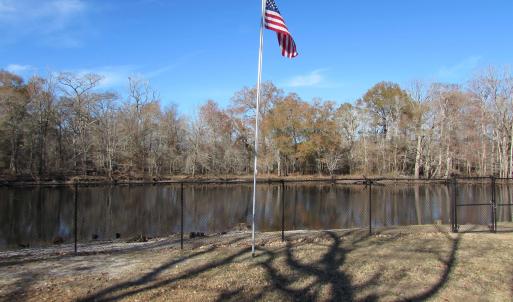 View of flagpole and river from the left side lot