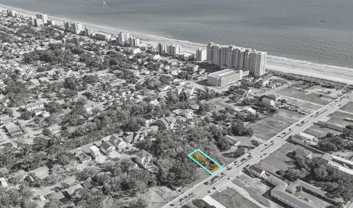 View of urban area with waterfront with a beach an