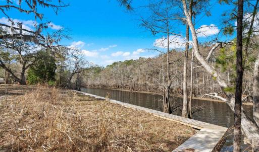 View of yard with a water view