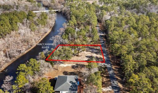 Aerial view of property and surrounding area with