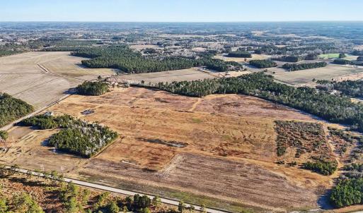 Aerial view of property and surrounding area with