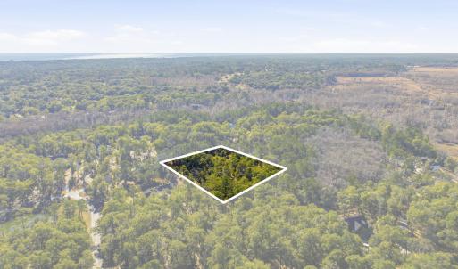 Aerial view of property and surrounding area with