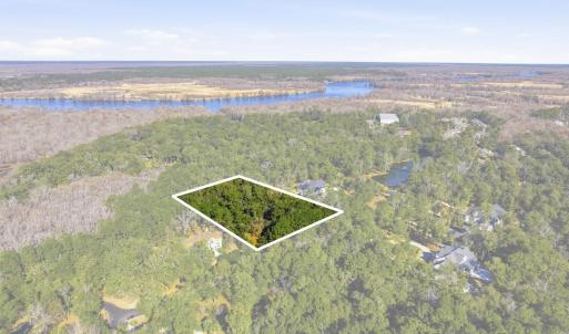 Aerial view of property and surrounding area with