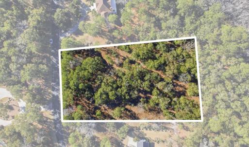 Aerial view of property and surrounding area with