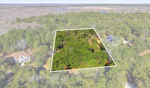 Aerial view of property's location with a nearby b