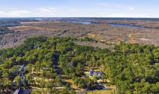 View of property location with a forest and a larg